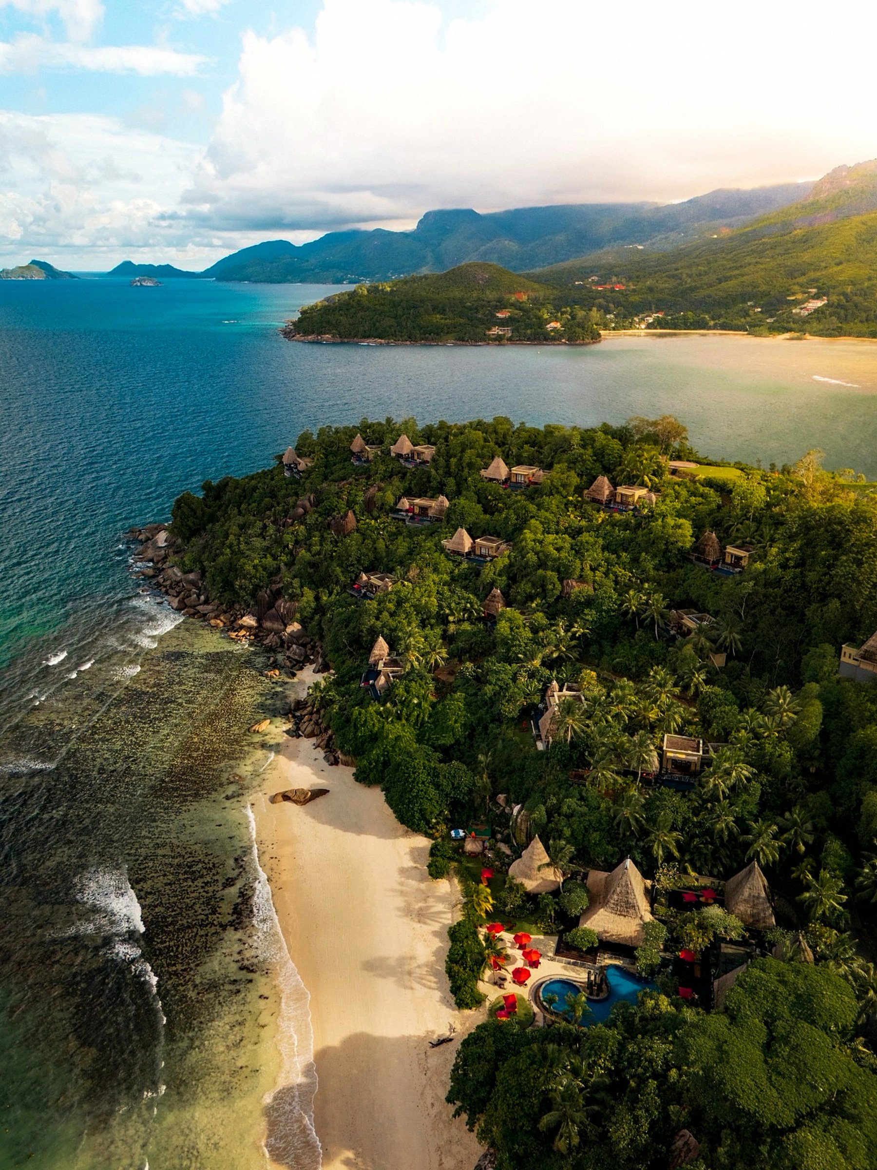 Aerial view over a tropical shoreline.