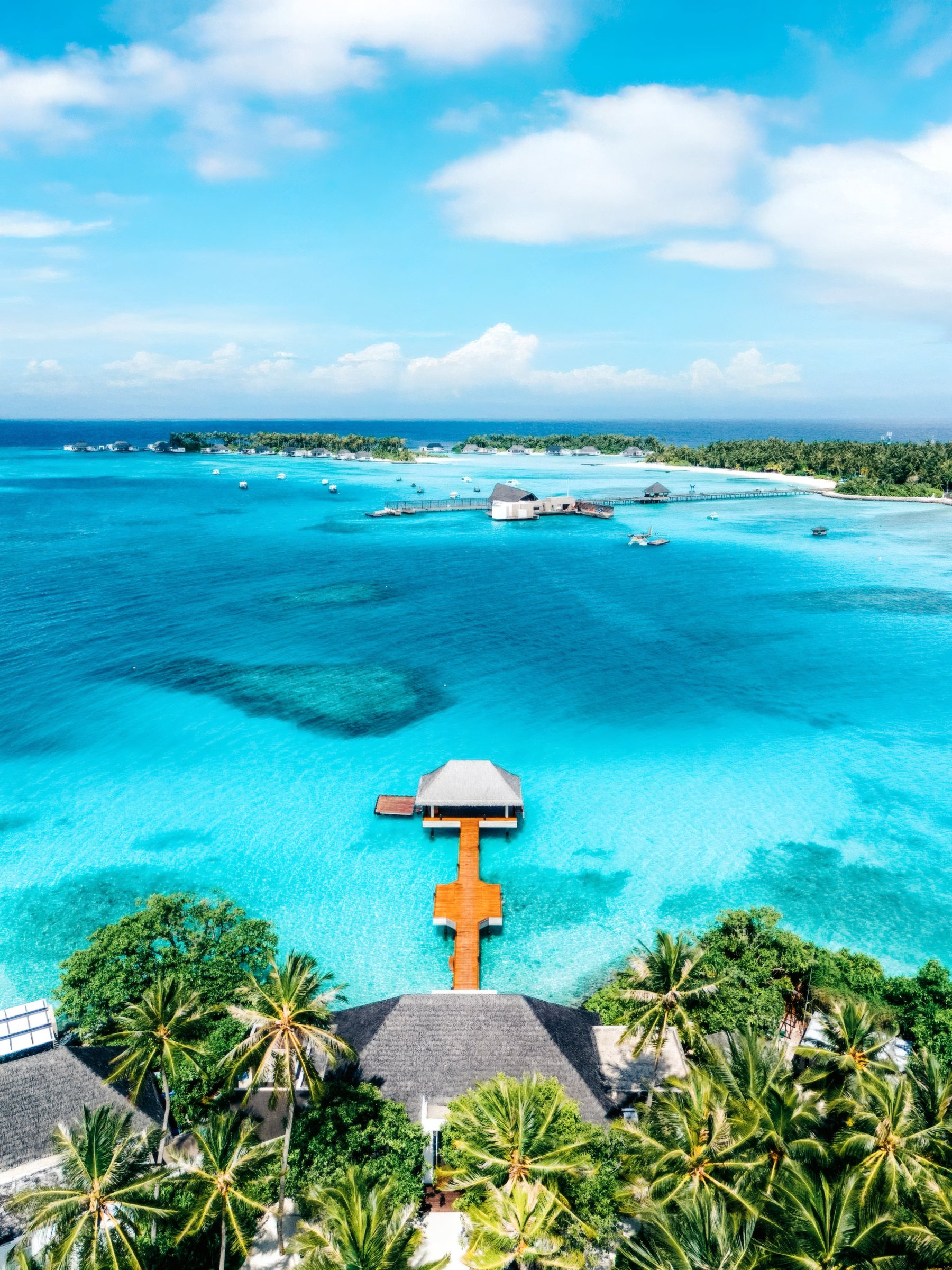 Bright turquoise lagoon seen from a tropical resort terrace.